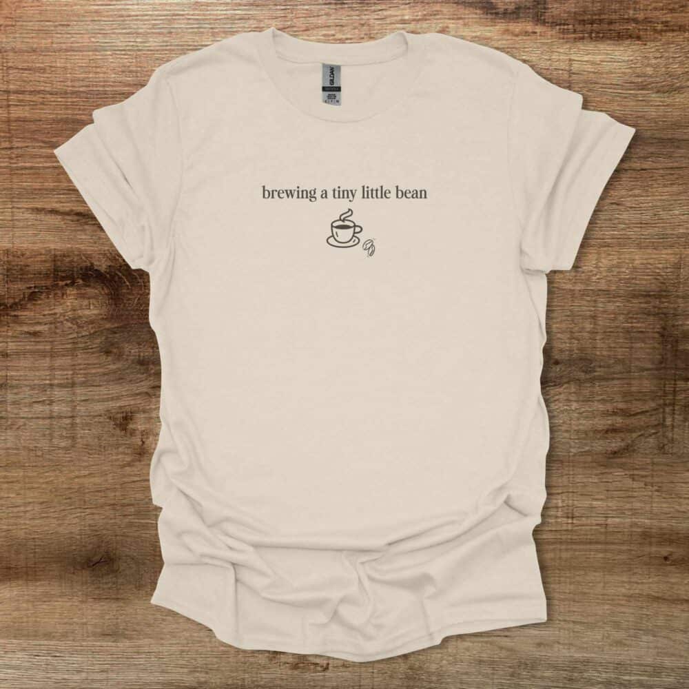 Brewing a Tini Little Bean Natural T-Shirt Unisex Brewing a Tini Little Bean Natural T Shirt Unisex